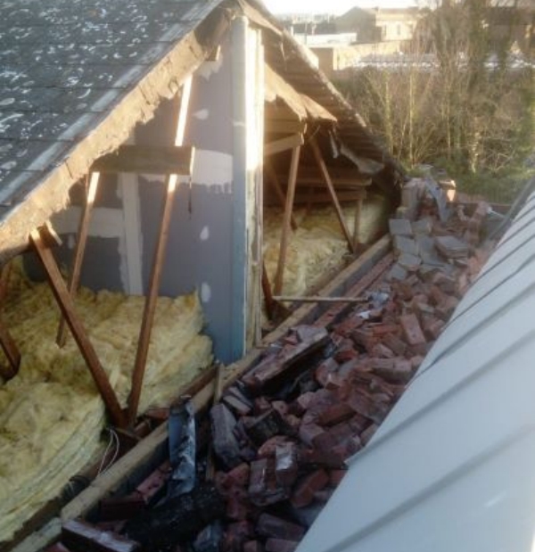 Storm damage to a gable wall